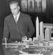 Robert Moses with a model of his proposed Battery Bridge